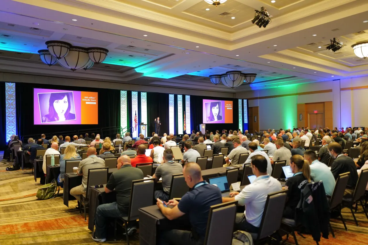 Dave Delaney, Nashville keynote speaker, on stage with an audience